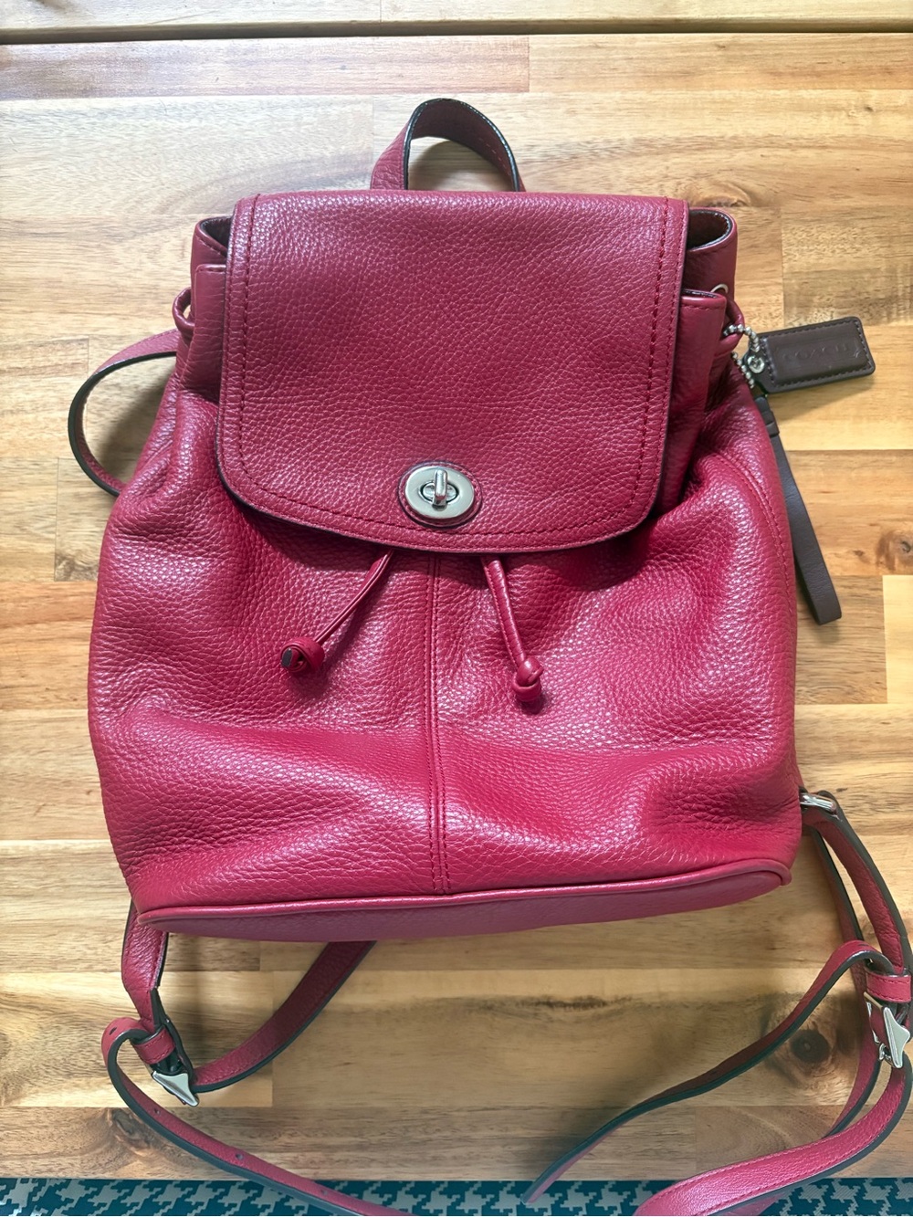 Coach Pebbled Leather Drawstring Backpack in Raspberry